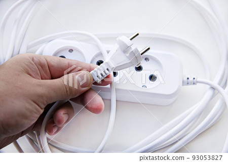 White electric extension cord, great design for any purposes. White background. White electric extension cord, great design for any purposes. White background. 93053827