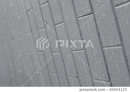 The texture of the wall from the old tile, painted gray under the influence of condensation. A lot of small drops and water stains on the wall The texture of the wall from the old tile, painted gray under the influence of condensation. A lot of small drops and water stains on the wall 93054125