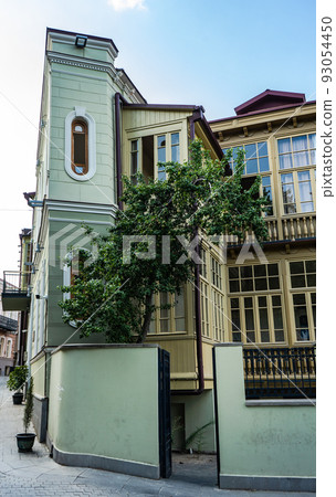 Traditional inner yard with carving wooden baclonies 93054450