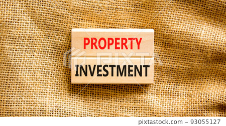 Property investment symbol. Concept words Property investment on wooden blocks on a beautiful canvas table canvas background. Businessman hand. Business Property investment concept. Copy space. Property investment symbol. Concept words Property investment on wooden blocks on a beautiful canvas table canvas background. Businessman hand. Business Property investment concept. Copy space. 93055127