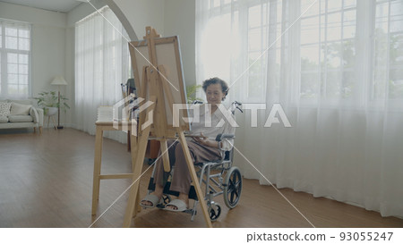 Artist concept of 4k Resolution. Asian woman drawing in the living room. Artist is creating work. People with disabilities are creating hobbies. Artist concept of 4k Resolution. Asian woman drawing in the living room. Artist is creating work. People with disabilities are creating hobbies. 93055247