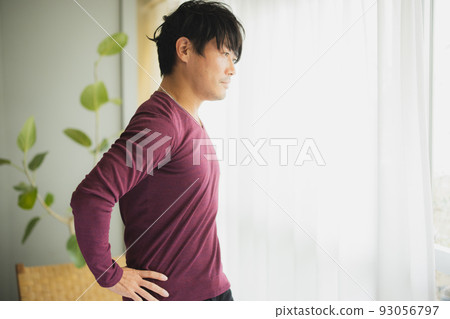 Man by the window Stretching 93056797