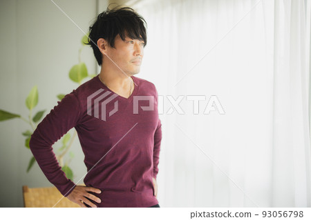 Man by the window Stretching 93056798