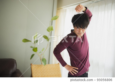 Man by the window Stretching Man by the window Stretching 93056806
