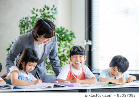 Elementary school students taking classes 93057092