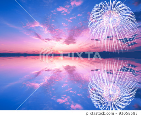 Fireworks and sunset reflected on the surface of the lake. An image of a summer sunset. Fireworks and sunset reflected on the surface of the lake. An image of a summer sunset. 93058585