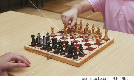 4K. Children play chess in the library 4K. Children play chess in the library 93059693