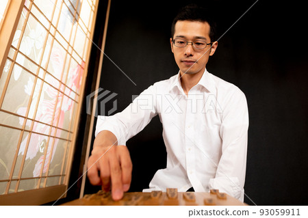 A man simulating a shogi match A man simulating a shogi match 93059911
