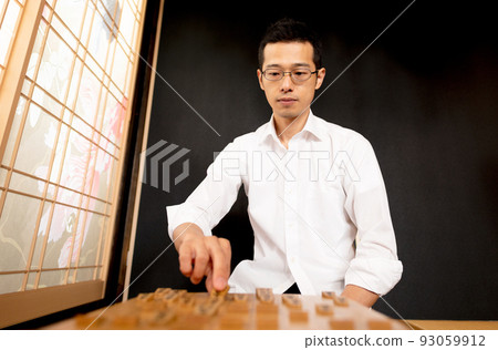 A man simulating a shogi match A man simulating a shogi match 93059912