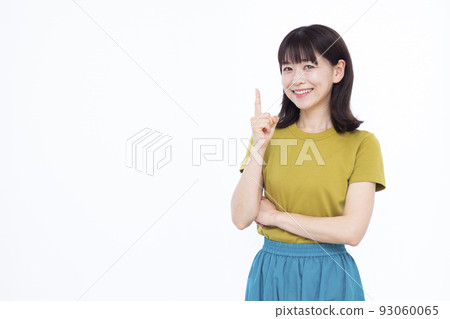 A woman in her thirties pointing 93060065