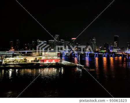 Miami city skyline panorama at dusk with urban skyscrapers and bridge over sea with reflection Miami city skyline panorama at dusk with urban skyscrapers and bridge over sea with reflection 93061823