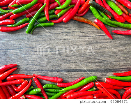 Fresh red chili and space for text on wooden background Fresh red chili and space for text on wooden background 93064571