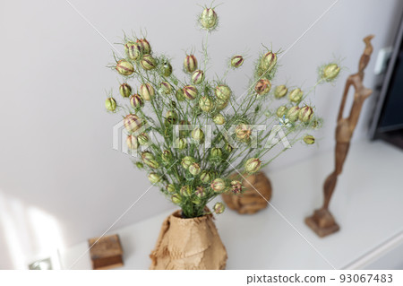 Decor bouquet in vase on white table Decor bouquet in vase on white table 93067483