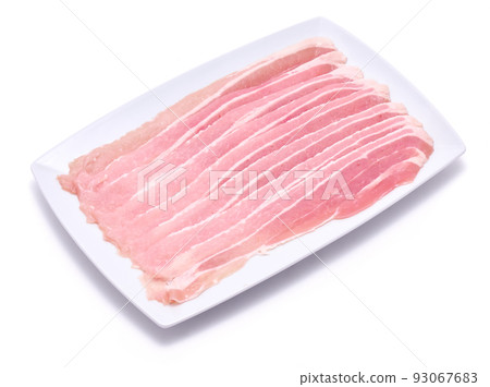 Bacon strips on ceramic plate isolated on white background 93067683