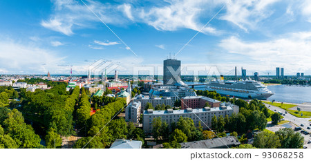 Aerial view of the large cruise ship docked in Riga port, Latvia near the old town and city center. Aerial view of the large cruise ship docked in Riga port, Latvia near the old town and city center. 93068258