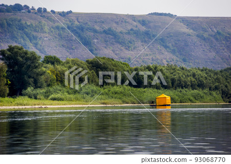 a blue raft with yellow canopy on the river, National Nature Park Dnister Canyon, Ukraine 93068770