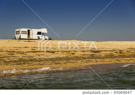 trailer-house on wheels on the Azov sea beach, Ukraine 93069047