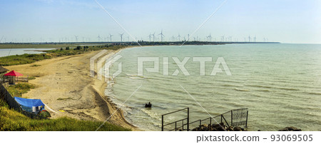 sea landscape and windmills farm on background, Azov sea, Ukraine sea landscape and windmills farm on background, Azov sea, Ukraine 93069505