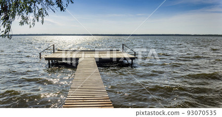 wooden pier on the lake 93070535