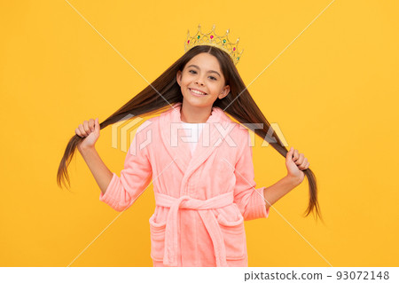 selfish happy teen girl in home terry bathrobe and princess crown has long hair, glory selfish happy teen girl in home terry bathrobe and princess crown has long hair, glory 93072148