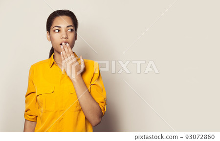 Portrait of a surprised woman student on white banner background Portrait of a surprised woman student on white banner background 93072860