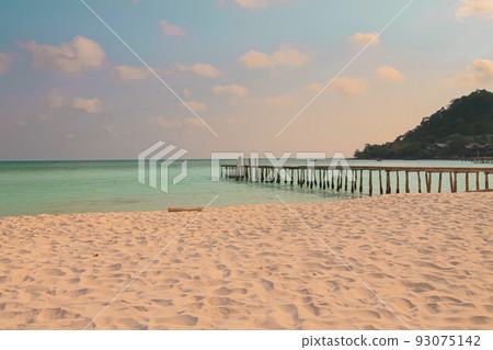 Dreamy summer scene of a wooden boardwalk leading to the vast sea horizon in Koh Rong island in Cambodia, a popular travel destination Dreamy summer scene of a wooden boardwalk leading to the vast sea horizon in Koh Rong island in Cambodia, a popular travel destination 93075142