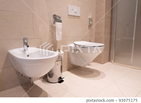 modern toilet with toilet, bidet and toiletries modern toilet with toilet, bidet and toiletries 93075175