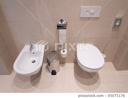 modern toilet with toilet, bidet and toiletries 93075176