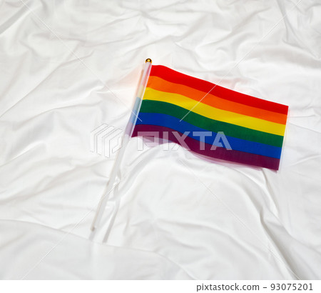 LGBT flag on a white sheet as a symbol of the purity of the rights movement LGBT flag on a white sheet as a symbol of the purity of the rights movement 93075201