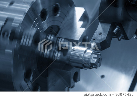 The  CNC lathe machine forming  cutting the metal shaft parts. 93075453