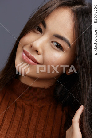 beautiful woman fun brown sweater posing casual wear Gray background beautiful woman fun brown sweater posing casual wear Gray background 93076550