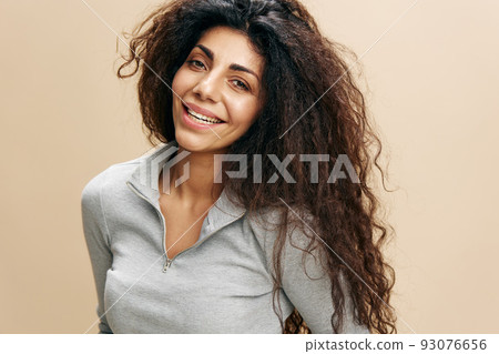 Closeup Shot Of Beautiful Young African American Female Laughing At Camera, Portrait Of Smiling Attractive Curly Millennial Woman Posing Isolated Over Beige Studio Background, Free Space, Banner Closeup Shot Of Beautiful Young African American Female Laughing At Camera, Portrait Of Smiling Attractive Curly Millennial Woman Posing Isolated Over Beige Studio Background, Free Space, Banner 93076656