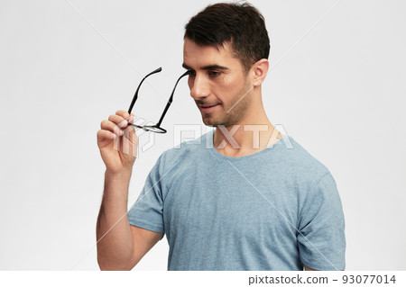 man in blue t-shirt glasses for vision smile emotions cropped view man in blue t-shirt glasses for vision smile emotions cropped view 93077014