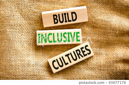 Build inclusive cultures symbol. Concept words Build inclusive cultures on wooden blocks on canvas. Beautiful canvas background. Business build inclusive cultures concept. Copy space. 93077178