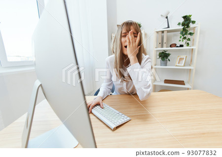 Upset blonde businesswoman made big mistake in report touch face makes facepalm sitting at workplace in modern office. Unhappy employee work on computer online in support service. Wide angle Upset blonde businesswoman made big mistake in report touch face makes facepalm sitting at workplace in modern office. Unhappy employee work on computer online in support service. Wide angle 93077832