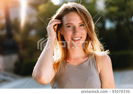 Portrait of a beautiful young woman outdoors Portrait of a beautiful young woman outdoors 93078330