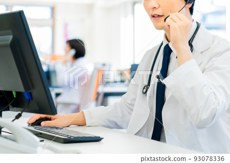 Young male doctor doing online medical treatment 93078336