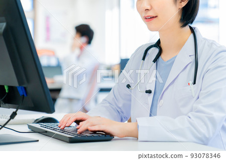 Young female doctor doing online medical treatment 93078346