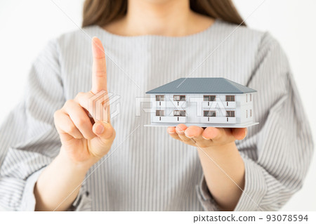Young woman with a model of an apartment Young woman with a model of an apartment 93078594