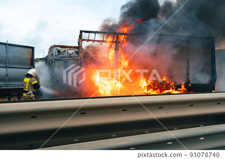 Car crash accident on a highway with damaged automobiles and smoke 93078740