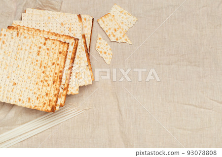 Matzo, Matzoth for Jewish Passover, Wooden background close up Matzo, Matzoth for Jewish Passover, Wooden background close up 93078808