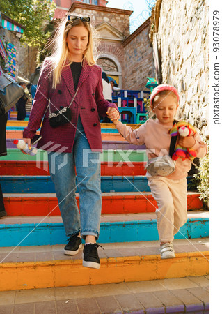 Mother and daughter on a walk in Balat district of Istanbul Mother and daughter on a walk in Balat district of Istanbul 93078979