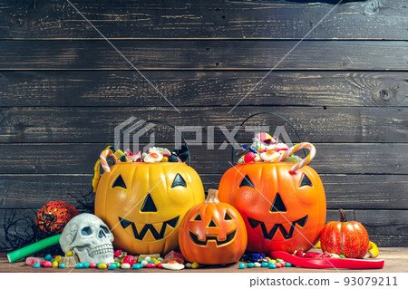 Happy halloween! Pumpkin with candy in the home. Happy halloween! Pumpkin with candy in the home. 93079211