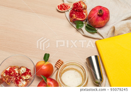 Red apple, pomegranate and honey jar for Jewish New Year on wooden board Red apple, pomegranate and honey jar for Jewish New Year on wooden board 93079245