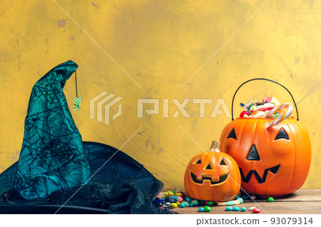 Happy halloween! Pumpkin with candy in the home. Happy halloween! Pumpkin with candy in the home. 93079314