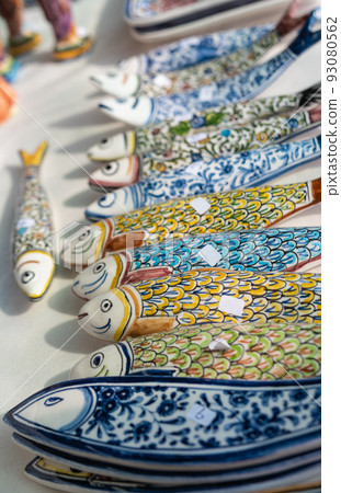 Stall with colorful Portuguese ceramic sardines 93080562