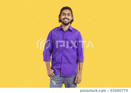 Portrait of happy ethnic Indian young man with snow-white smile on orange background. 93080774