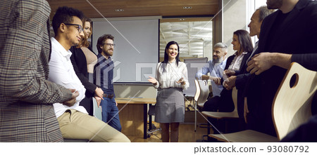 Diverse team of happy business people having a work meeting in the company office Diverse team of happy business people having a work meeting in the company office 93080792