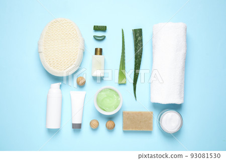 Flat lay composition with aloe vera and cosmetic products on light blue background 93081530
