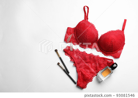 Composition with elegant women's underwear on light background, flat lay Composition with elegant women's underwear on light background, flat lay 93081546
